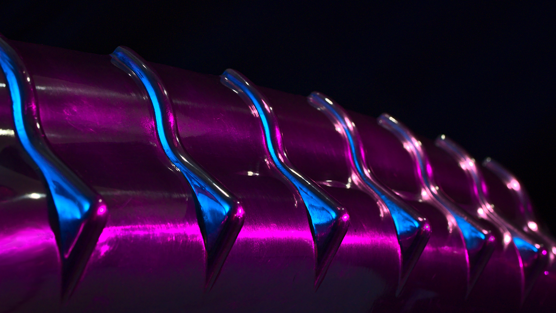 <p>A close-up of a purple and blue cable.</p>