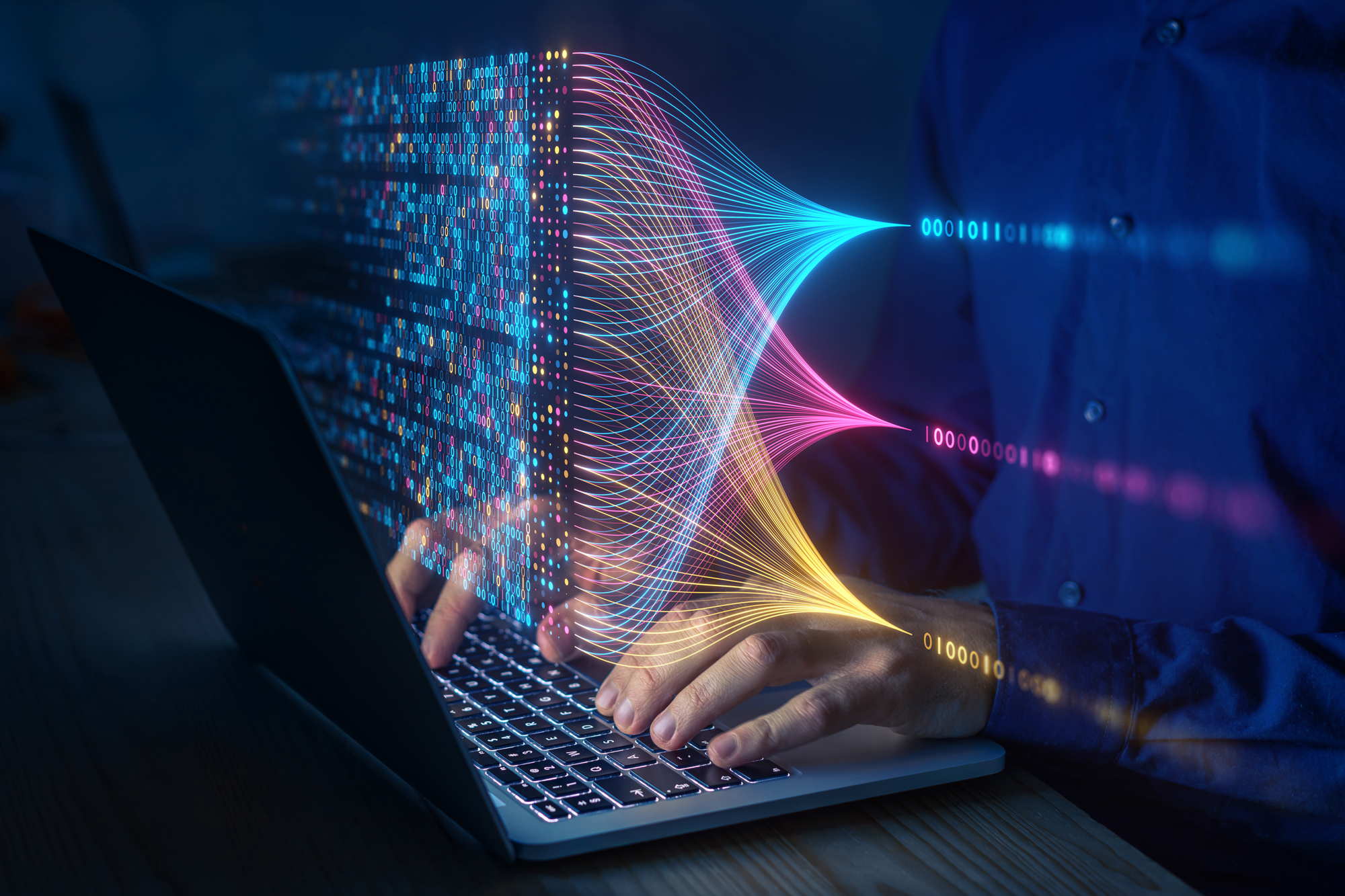 <p>A pair of hands working on a laptop in a dark environment and computing, analysing and visualizing complex data sets.</p>