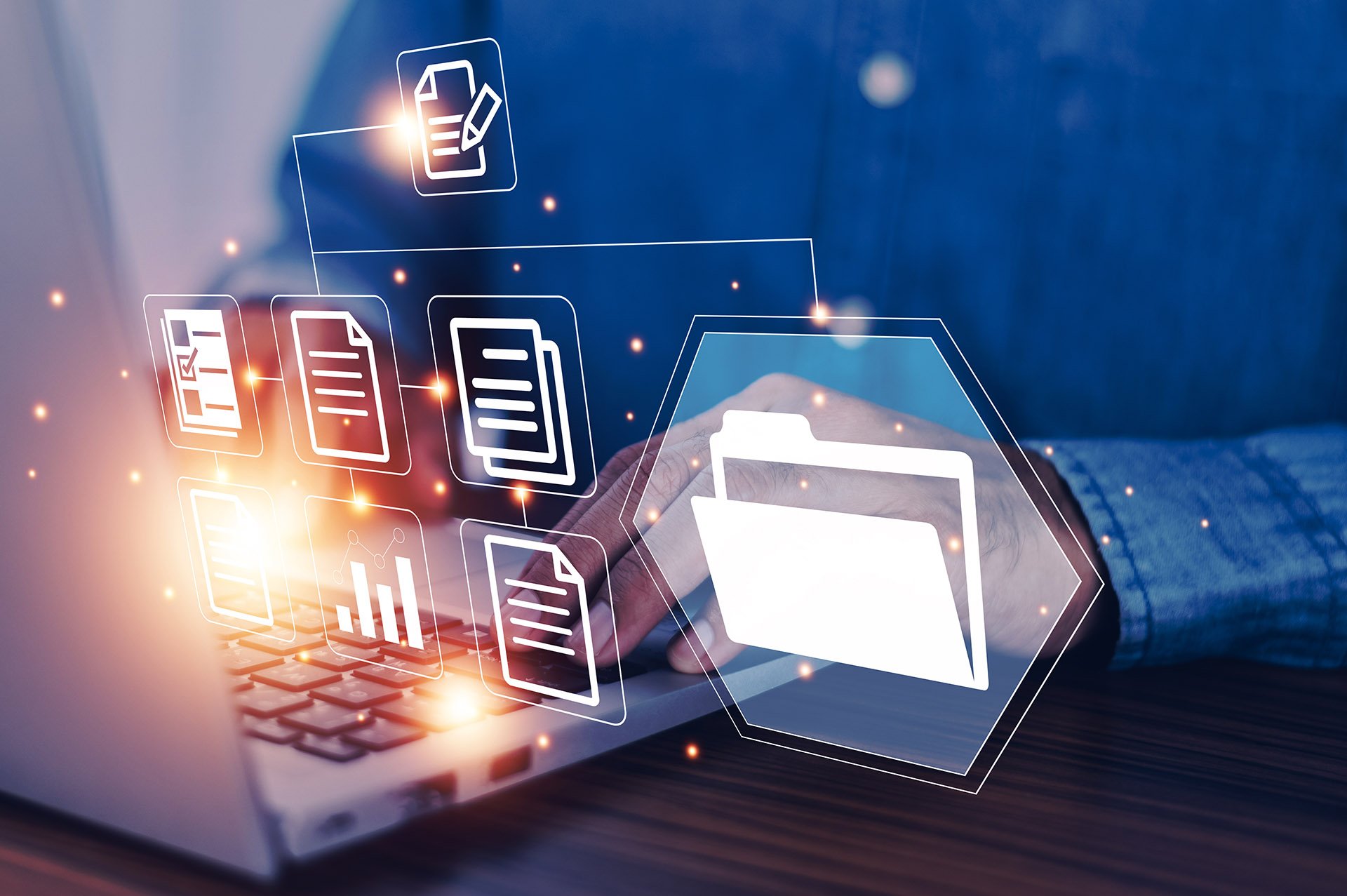 A person’s hand typing on a laptop keyboard, surrounded by digital file icons and organizational graphics, symbolizing data management.