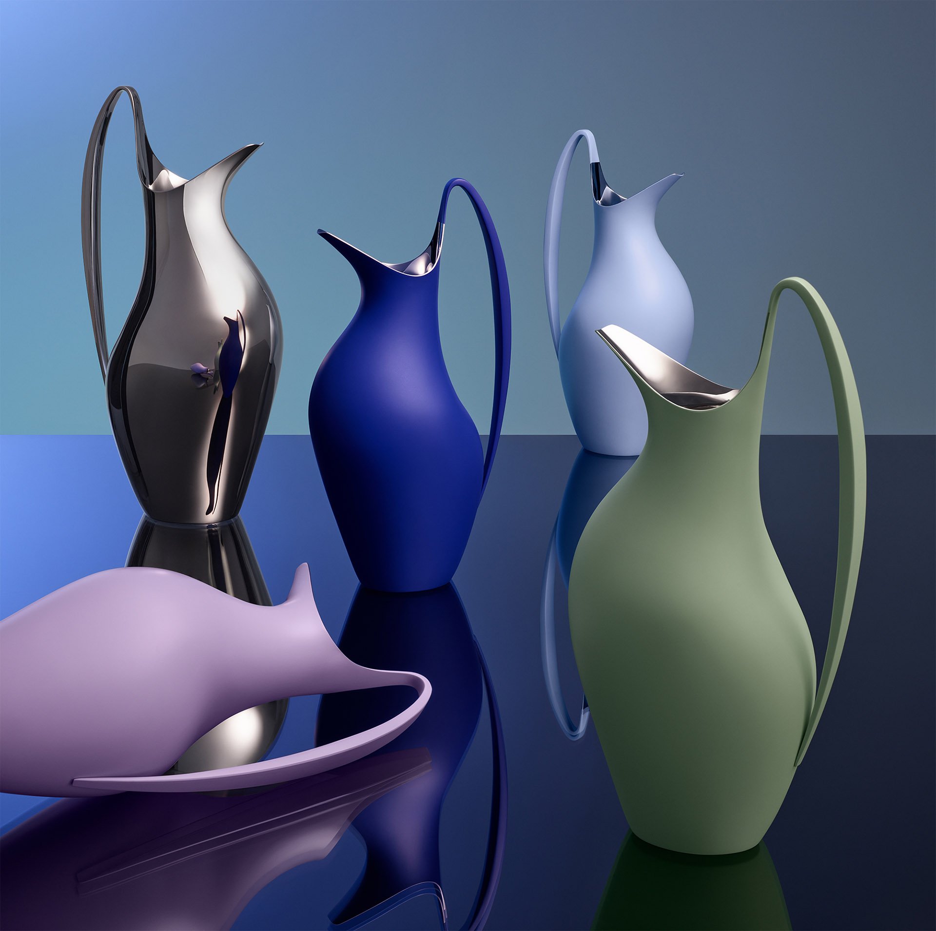 Collection of modern, sculptural pitchers in various colors and finishes displayed on a reflective surface.