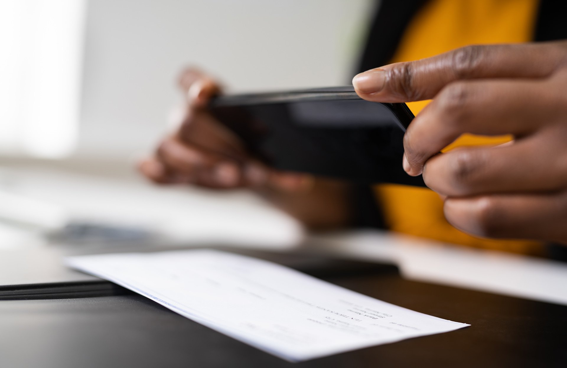 Contactless payment being made with a smartphone at a point-of-sale terminal.