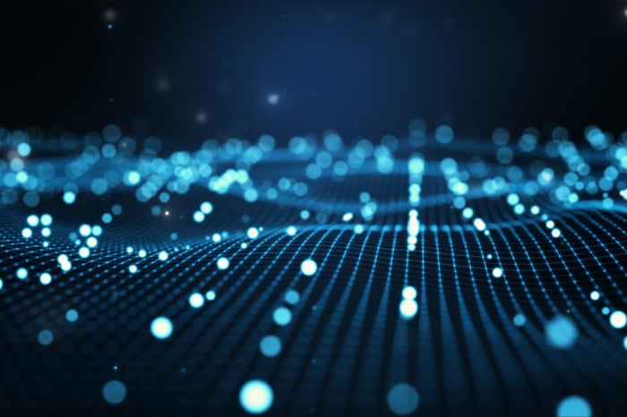 Abstract design featuring blue dots scattered across a black background, creating a visually striking contrast.